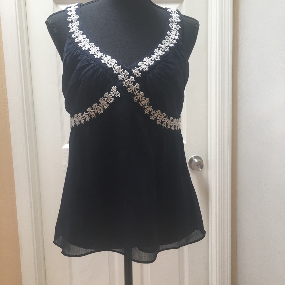 Sleeveless navy blouse from Ann Taylor LOFT.